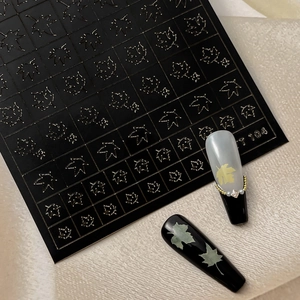 Hollow maple leaf nail art stickers with metallic relief for autumn manicure designs