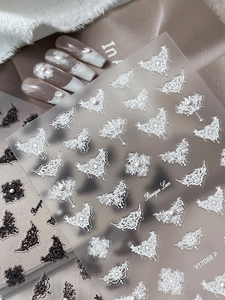 Detail of Baroque Lace 3D embossed nail stickers with white butterfly and pearl accents