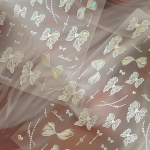 Autocollants 3D pour ongles à nœuds avec fini perlé holographique et motifs rubans