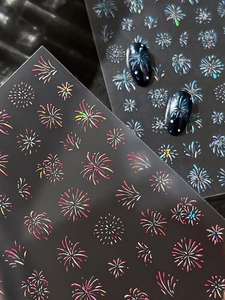Detailed macro view of 3D holographic firework nail stickers with laser glitter finish