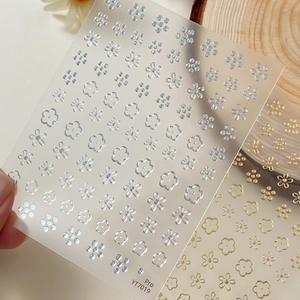 Minimalist gold and silver flower nail stickers with metallic foil floral designs