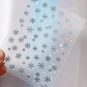 Blue and silver snowflake nail art stickers with metallic bronzing and embossed texture