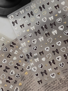 Detail of YT7166 Pro+ nail art stickers with embossed gold butterfly and heart designs