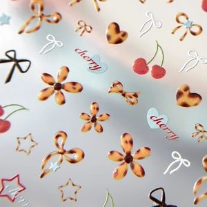 Autocollants ongles ambre gel avec nœuds léopard, cerises et motifs d'étoiles