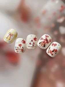 Macro shot of 3D embossed Christmas dog nail art stickers with cute heart and bow designs