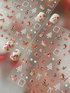 Detailed 3D embossed Christmas nail art stickers with cute puppies and holiday patterns