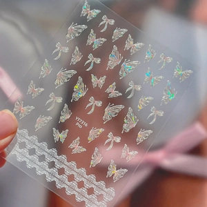 Iridescent butterfly and lace nail art stickers with shell glitter finish for manicures