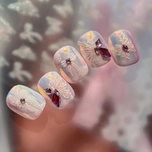 Exquisite 3D butterfly nail stickers with pearly pink finish and sparkling rhinestones