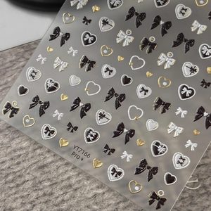 3D embossed nail stickers with gold heart and bow patterns on professional YT7166 sheet
