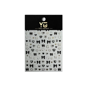 3D embossed nail art stickers featuring golden heart and bow designs on black card