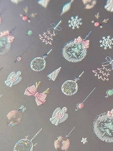 Detailed 3D embossed Christmas nail stickers featuring silver angels and iridescent snowflakes