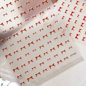 Autocollants 3D pour ongles nœuds rouges avec texture en relief sur papier
