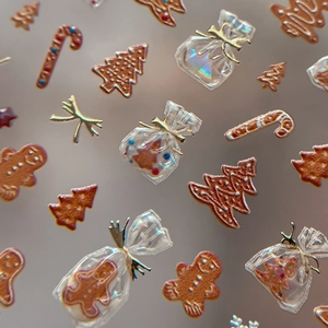 3D embossed Christmas nail stickers featuring gingerbread man and tree festive designs