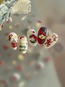 3D embossed Christmas nail art stickers featuring Santa Claus and gingerbread man designs