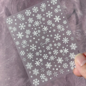 3D embossed snowflake nail art stickers with elegant white winter patterns for manicure