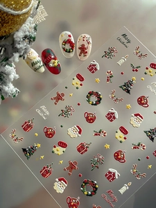 3D relief nail art stickers featuring Santa Claus, gingerbread man and festive patterns