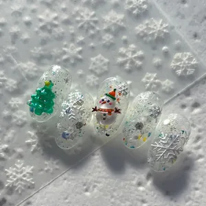3D Christmas embossed nail stickers featuring green trees, snowmen and white snowflakes