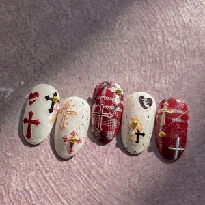Gothic wine red and cream press-on nails with 3D cross charms and heart accents