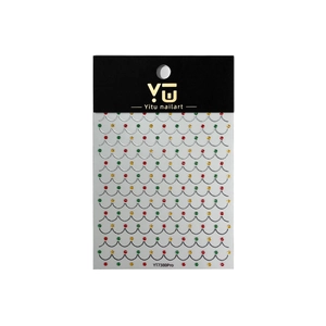Christmas nail art stickers with gold, red and green 3D beads on a white background
