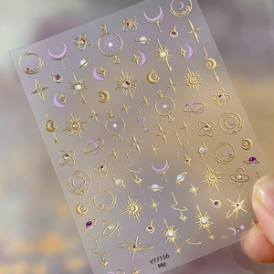 Star and moon gold foil nail stickers featuring celestial patterns in gold and purple