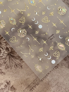 Macro shot of French retro gold embossed nail decals with pearls and stars, model YT7099