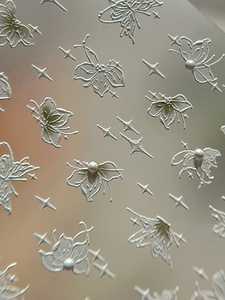 Detailed 3D embossed butterfly and star nail stickers with elegant pearlescent finish