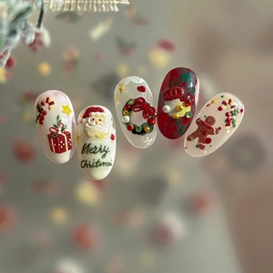 3D embossed Christmas nail stickers featuring Santa, gingerbread man and holiday designs