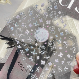 Embossed secret garden nail stickers with blue floral, butterfly and heart patterns