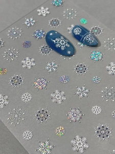 Detail of snowflake nail art stickers with 3D embossed and laser holographic effects