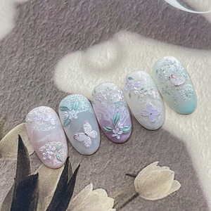 3D embossed floral nail stickers with butterfly and lace patterns in pastel colors