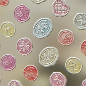Relief nail stickers featuring pink rose, heart, and bow in macaron colors on golden base