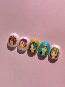 Macro detail of hand-painted anime character nail stickers with laser reflective hair details