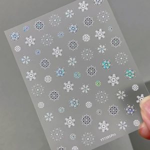 Sparkly laser silver snowflake nail art stickers with metallic blue finish for winter manicures