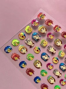Close-up of colorful cartoon character nail art stickers with laser glitter finish