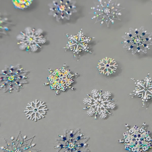 Holographic 5D embossed silver snowflake nail art stickers with blue glitter accents