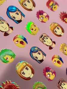 Macro detail of holographic anime nail art stickers with vibrant laser colorful effects