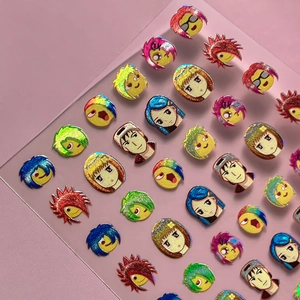 Holographic anime character nail art stickers with laser glitter effect on pink surface