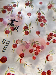 Macro detail of YT6152 jelly lychee nail stickers with realistic fruit and leaf patterns
