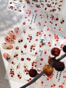 Close-up of YT6152 nail stickers featuring red lychee fruits and Chinese calligraphy art