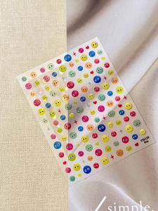 Detailed view of YT6139 Pro nail stickers with colorful emoji eyes and heart patterns