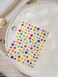 Close-up of YT6139 Pro colorful jelly eye nail stickers on a white porcelain dish
