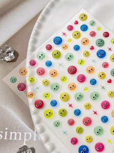 Macro shot of 3D colorful jelly dot eye stickers with cute cartoon facial expressions