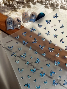 Detailed holographic laser butterfly nail art stickers in dark blue for salon manicure