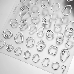 Silver glitter heart nail stickers with rhinestones in minimalist fluid organic shapes