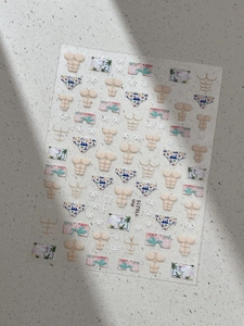 Detail view of summer nail art stickers featuring tropical swimwear and beach themes