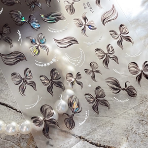 Exquisite bow and pearl nail art stickers with laser holographic accents for manicure