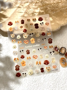 Detail of 3D embossed nail stickers featuring puppies and butter cookies, style YT6137