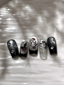Macro detail of gothic black swan nail stickers with rhinestones and dark rose art