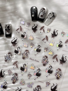 Detail of Black Swan nail stickers featuring laser glitter finish and crown motifs