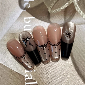 French lace press-on nails set with metallic gold and pink bow accents